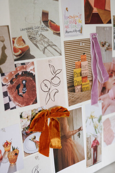 Close up of printed photos and ribbons on an inspiration board