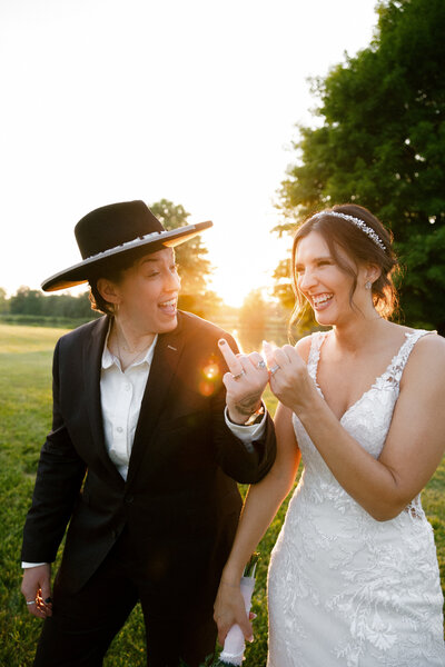 Couple laughing naturally during their wedding vows in Cincinnati outdoor ceremony

