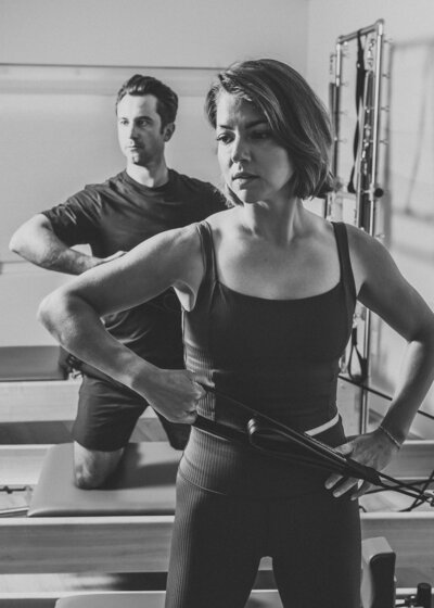 Two women on Pilates reformers