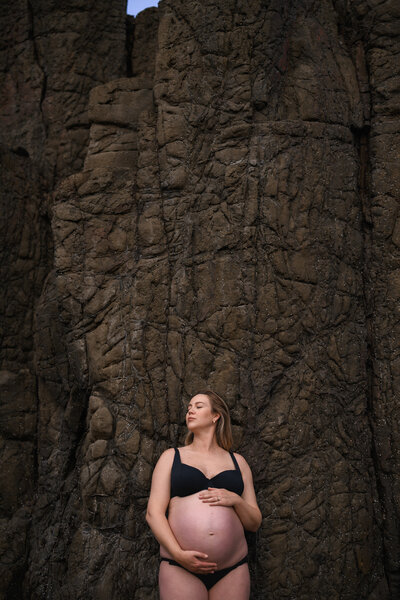 Pregnant woman during photoshoot at Sydney beach
