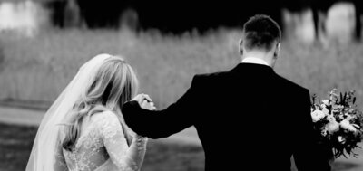 Bride-and-Groom-Walking-Hand-in-Hand-at-Castle-Leslie