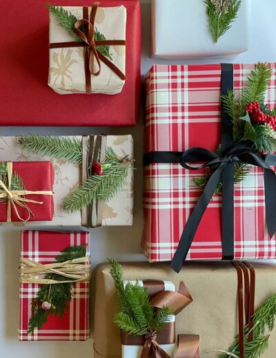 Make-Christmas-gift-wrap-special-with-real-faux-greens-and-flowers-and-ribbons