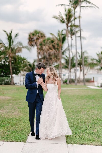 Destination wedding photography of couple walking around tropical resort