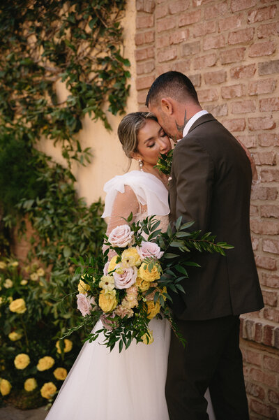 Stunning wedding venue photo showcasing a beautifully decorated reception hall, with elegant floral arrangements, ambient lighting, and a romantic atmosphere perfect for a celebration.