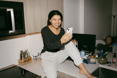 Catryce on the Counter Smiling at Phone