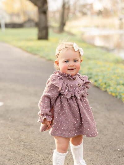 portrait of baby girl at cherry blossom session