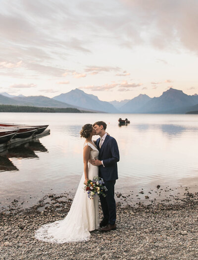 couple kissing by water