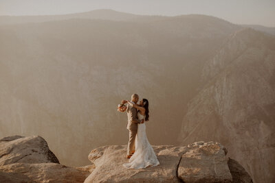 Bride and groom kiss at Taft Point