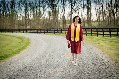 cap and gown senior outdoors girl