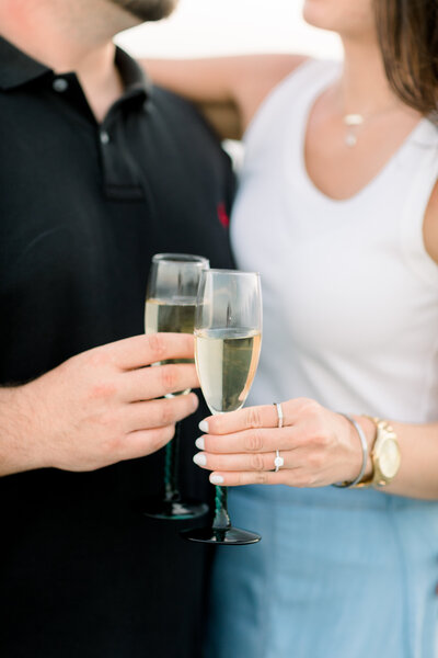 celebrate with champagne and a beach proposal photographer