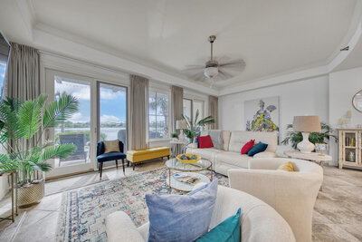 Beautiful lakefront balcony with tall Adirondack chairs and table set