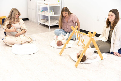 Infants playing with activity toys