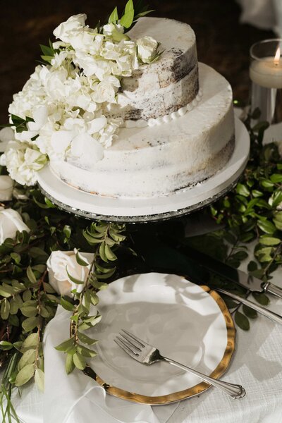 large white wedding cake at charlotte reception