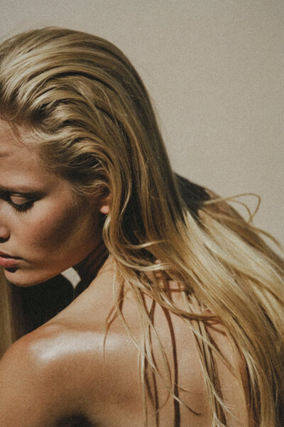 Blonde woman in soft natural light, luxury content shoot for social media strategy