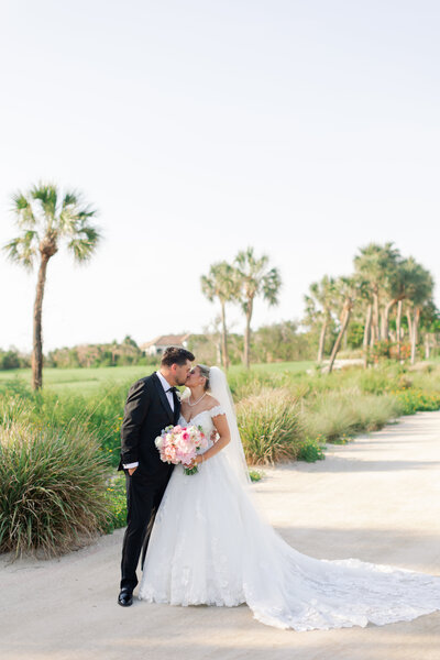 bride and groom kissing on their wedding day in Captiva Island, FL