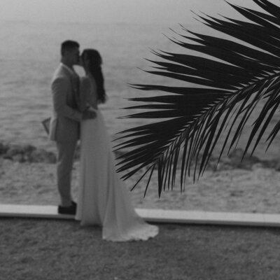 bride and groom smiling and embracing by wedding photography naples fl