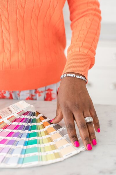 Woman's hand and Pantone color book