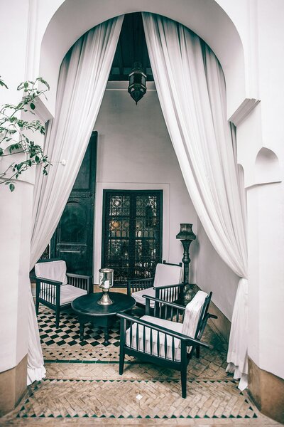 Luxury balcony with curtains and intimate seating