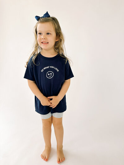girl wearing toddler true40 navy t shirt