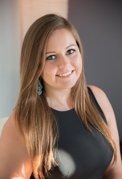Professional Headshot of Hiliary Holbrook wearing black dress