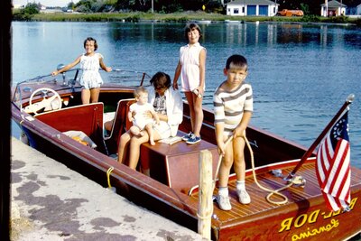 Young children playing on vintage boat