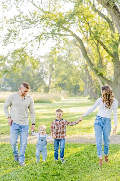 Family walking together at Columbus County Park.