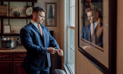 Groom getting ready in the groom’s suite | English Manor Wedding | Ocean Township, New Jersey