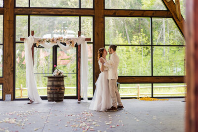 Bride and groom kiss during sparkler exit at the end of Port farms wedding