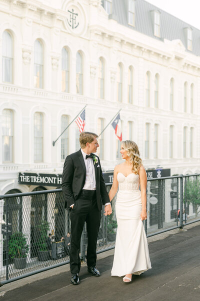 bride and groom on the roof of the tremont house in galveston
