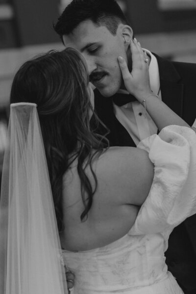 An intimate photo of a bride and groom captured by a documentary wedding photographer.