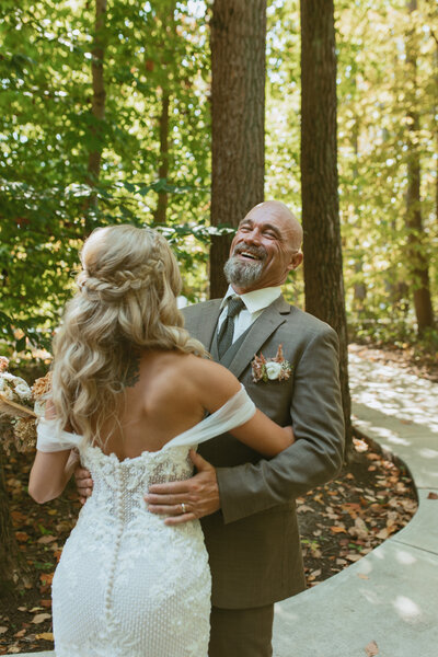 father smiling at his daughter