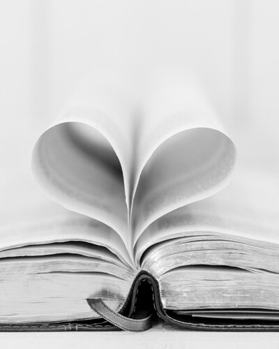 The Bible’s pages forming a heart at Jennifer Hall Photography, LLC.