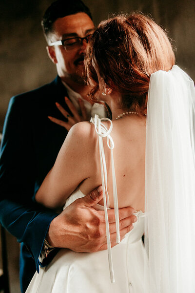 Bride and groom sharing their first kiss at a Jacksonville wedding ceremony.