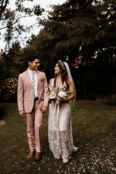groom-in-pink-suit-with-bride