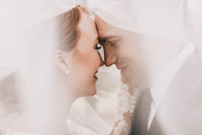 Bride & groom under veil at Olympic View Estate