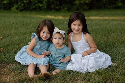 family smiling at the camera