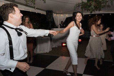 bride and groom dance on dance floor at charlotte wedding