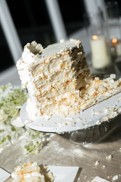 bride and groom outside looking at each other smiling