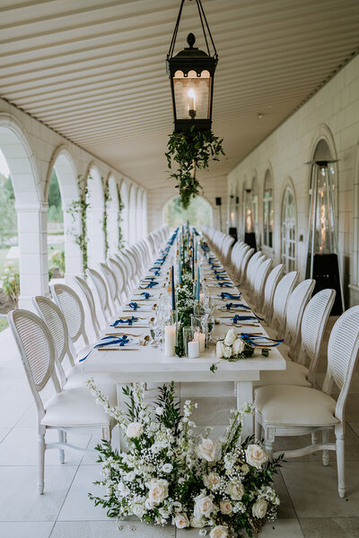 Long family style table set under the terrace at Archway manor