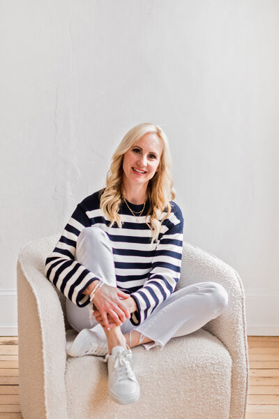 woman sitting on a chair smiling