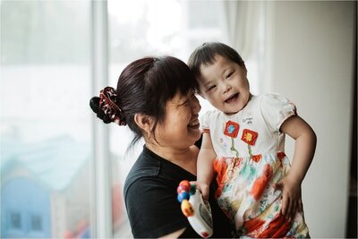 orphanage worker with down syndrome baby