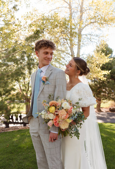 wedding cake with Mr. and Mrs. cake top and light pink roses beautifully designed