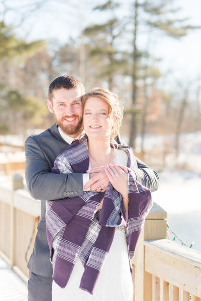 Bride and Groom sharing their first kiss during outdoor wedding