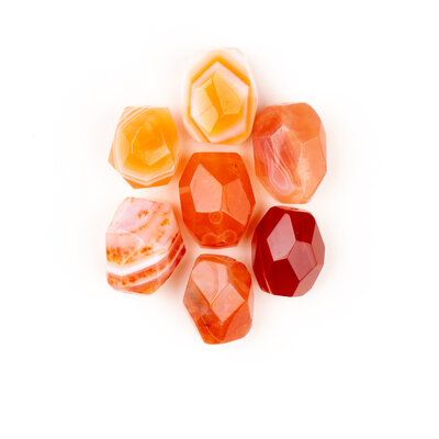 Orange and yellow cut stones  arranged to look like a flower