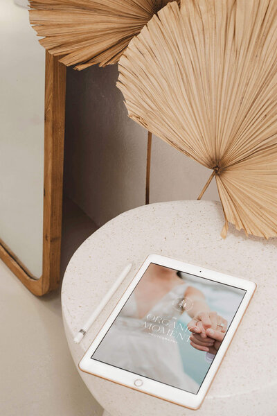 A custom Showit website design for an elopement photographer shown on an iPad