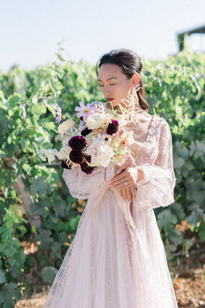 chinese bride in a vineyard field in Saint Emilion