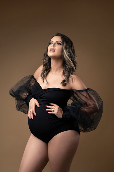 Puyallup Mom in Maternity Photo in Studio in Black bodysuit on Tan Background