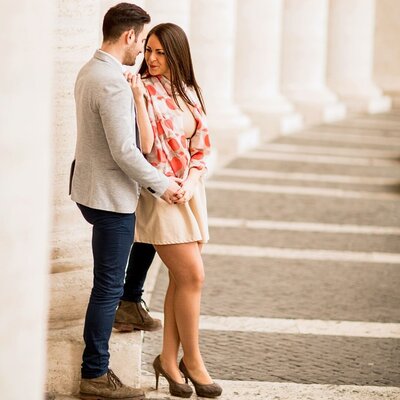 A couple poses for an engagement photography session.
