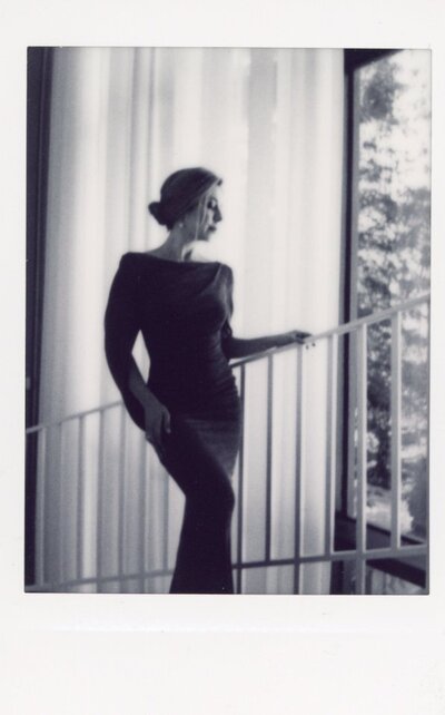 Olivia Boen, Hamburg based Opera Singer, photographed on Instax instant film in black and white. She's posed on the stairs of the Art Institute in Chicago by Chicago photographer, Renata Voci.