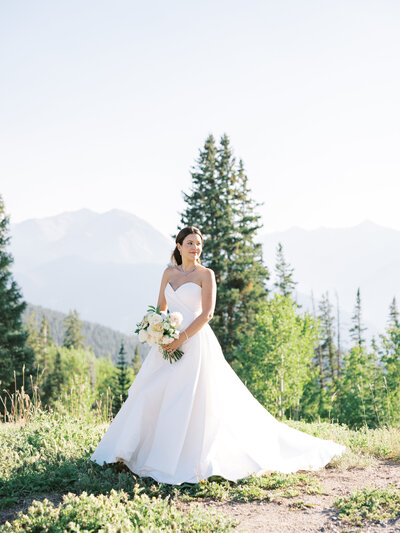 Bride on a mountainside by Denver wedding photographer Sarah Nann